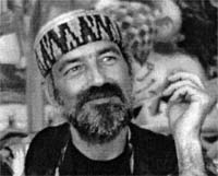 Ra Uru Hu in a knitted cap, smiling, during a Taos television appearance in December 1993